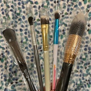 Sample makeup brushes, various sizes and brands.